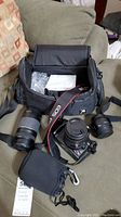 Overall kit displayed including camera, lenses, and carrying case