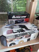 Cargo carrier bag in box showing product and branding