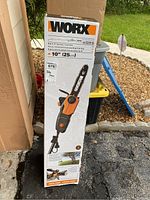 Boxed WORX 2-in-1 10' Pole Saw / Chain Saw showing product image and features