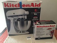 Original KitchenAid Classic Plus mixer box alongside Food Grinder attachment box on table