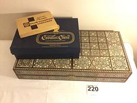 Overview of all three boxes: Mosaic inlay game box, Pleasantime Club Champion checkers, Cavalier Chess