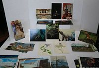 Wide view showing multiple postcards including wildlife, nature scenes and landmarks