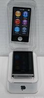Front view of Apple iPod Nano inside plastic case showing touchscreen with app icons and home button