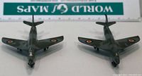 Top view of two Dinky Toys Hawker Hunter model airplanes with visible RAF roundels, shown side by side for scale and condition assessment.