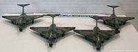 Front view of four Gloster Javelin model airplanes showing cockpit area, nose, and wing shape.
