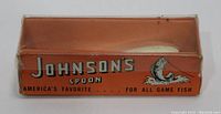 Orange Johnsons Spoon branded box with fish illustration and text indicating it is America’s favorite for all game fish.