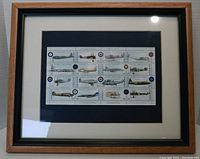 Framed sheet of Canada Post stamps showing 12 RCAF aircraft under glass in wooden frame.