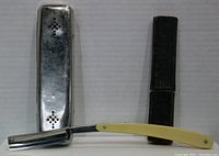 R Cadman & Sons Bengall straight razor with yellow handle, black leather case, and perforated silver metal box shown together