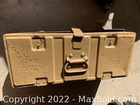 Closed beige metal box marked 1942 and military stamps