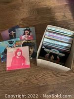 View of box showing a variety of mixed genre album covers including colorful artistic and photographic designs.