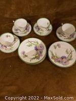 Set of 4 cups and 4 saucers with purple thistle floral design and green trim