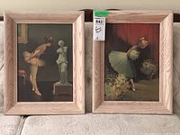 Two wood-framed textured ballerina prints on board, shown side by side on a lace tablecloth.