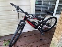 Full side view of Hyper 16 mountain bike showing frame, tires, pedals, and handlebars.