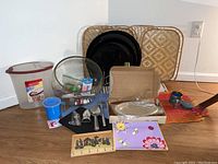 Overview of all items including trays, mixing bowl, cooking utensils, placemats, decorative mug, key ring hanger, and small containers.
