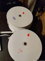 One stack of Velcro rolls labeled 'HOOK' and another labeled 'LOOP'.