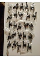 29 individually bagged mini fans arranged on a flat surface showing quantity and packaging.