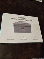 Box showing product as UVC LED Multi-function Sterilizing Bag with features of 5mins fast sterilization, physical sterilization and killing rate up to 99.9%, radiation free safe.