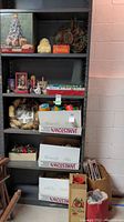 Shelf unit in basement holding the Christmas decorations including boxes and baskets with assorted holiday items