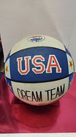 Close-up image of the basketball showing USA and Dream Team lettering in white, blue, and red color scheme.