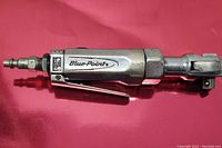 Close-up side view of Blue-Point air ratchet showing brand name and hose adapter connection.