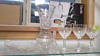 Photo showing large crystal vase, crystal goblets, and rectangular crystal dish.