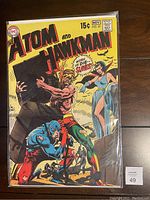Full front cover view of The Atom and Hawkman #45 comic book showing main characters and title.