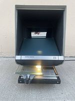 Front view of Bell & Howell 920 Micro Design microfiche reader showing the viewing screen with a light underneath.