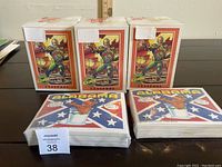 Three sealed 1991 GI Joe Series 1 trading card sets in their original boxes with cover art and three sealed 1987 U.S. of Alf trading card sets featuring state flags visible, all unopened and new.