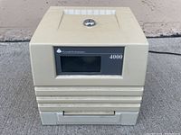 Photo of the Pyramid 4000 Electronic Time Recorder front view showing keypad slot, display window, and top key slot.