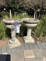 Frontal view of both planters upright on patio