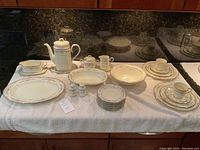 Various Noritake Bone China Shenandoah pattern serving pieces displayed on towel