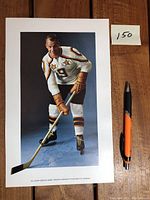 Full front view of the 7x11 color advertisement featuring Gordie Howe in hockey gear, showing the autograph in blue pen.