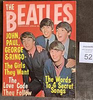 Color cover photo showing all four Beatles (John, Paul, George, Ringo) in suits with bold title and feature text.
