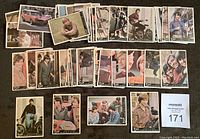 Array of The Monkees 1967 Donruss trading cards laid out showing multiple band members and scenes from the show.