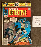 Front cover photo showing Batman in mid-action holding a man off the ground. Yellow and red title with issue number 459 from May 1976 visible.