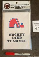 Front of sealed Quebec Nordiques hockey card album packaging with team logo and NHL branding.