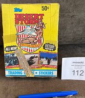Front and top view of 1991 Topps Desert Storm Victory Series unopened wax box showing graphics, factory tape and wear
