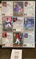 Page of 9 baseball cards showing signed cards of Jaret Wright, Mark Farris, Nomar Garciaparra, Paul Konerko, Jason Varitek, with signatures on front.