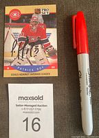 Full view of the autographed Patrick Roy 1990-91 Pro Set hockey card with red Sharpie pen for scale.