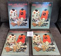 Four 1988 Esso NHL All-Star Collection hockey albums displayed together, two vertical and two horizontal, showing album front covers with vintage hockey gear design.