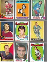 Front view of nine hockey cards showing players Stan Mikita, Bill Barber, Bob Nevin, Rod Gilbert, Ron Stewart, Dean Prentice, Bob Plager, Jean Ratelle and a Phil Esposito trophy card