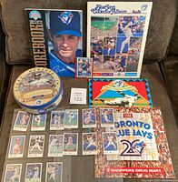 Overview of all items including calendars, collector album, sticker set, metal tin, and signed card