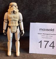Front view of vintage 1977 Kenner Star Wars Stormtrooper action figure standing upright showing minor wear on helmet, arms, hands, and legs.