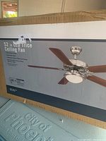 Box side showing image and size 52 inch LED ceiling fan with brushed nickel and reversible blades.