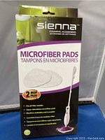 Packaged Sienna microfiber mop pads showing packaging and product details on the front, indicating compatibility with Vibe models and that each package contains 2 pads.