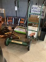 Green Lee Valley manual push lawnmower with metal reel blades and black handle.