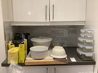 Overview photo showing all ceramic mixing bowls, the Breville appliance, coffee filters, and a sous vide or glass bowl on countertop