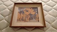 Front view of framed painting showing artwork, mat and frame