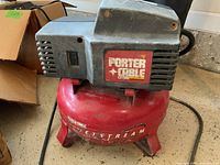 Front view showing the Porter Cable brand label on the motor housing and red tank.