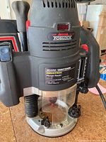 Close-up front of Sears Craftsman plunge router showing labels and controls